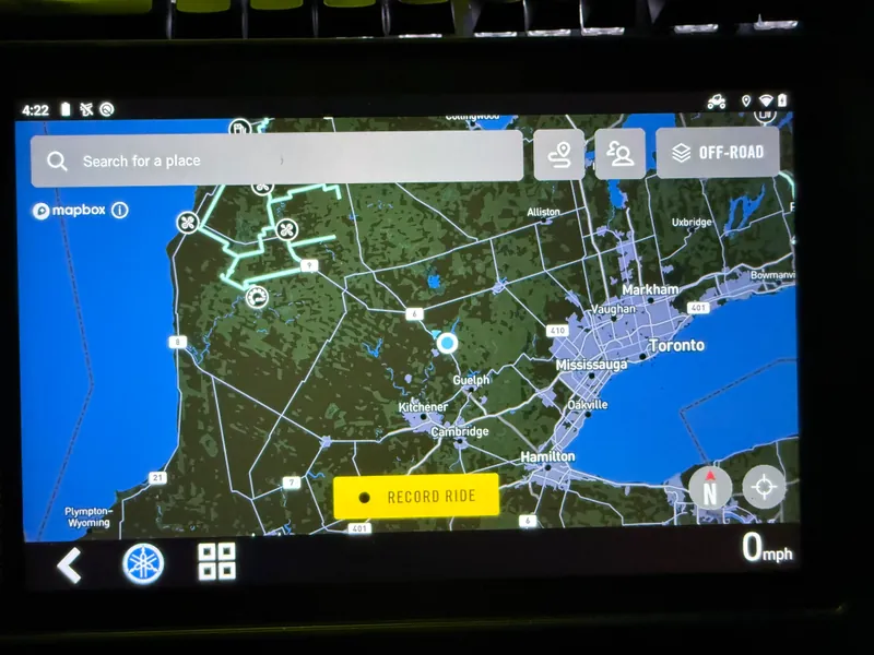A full-screen mapping app running on the G8 cluster, showing a road map, a search field, an off-road toggle and a record-ride button.
