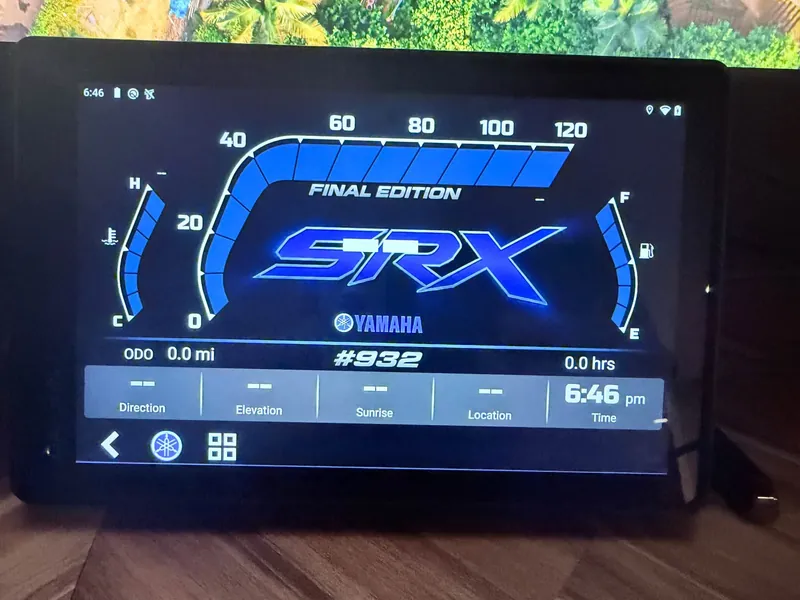 G8 cluster showing a custom blue theme, with a blue tachometer arc, a large graphic across the centre, and coolant, intake-air and GPS readouts below it.